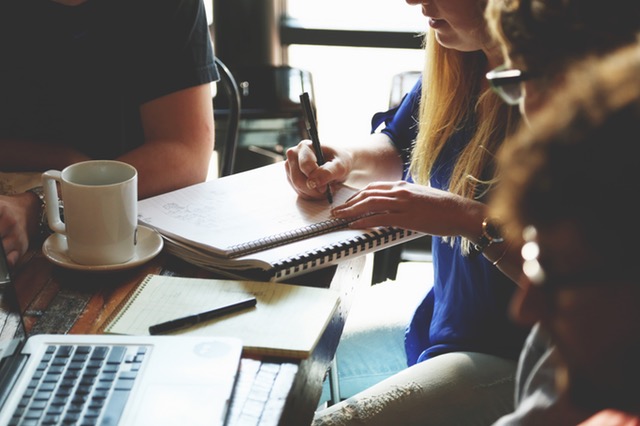 People having a meeting about a website project.