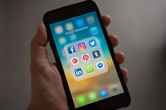 An iPhone screen displaying social media app logos